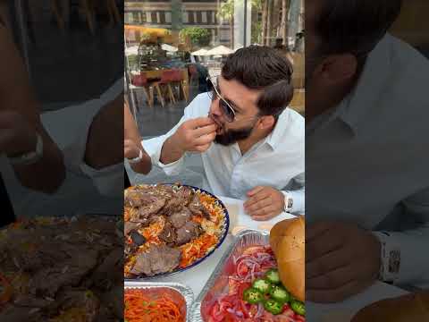 Arman Tsarukyan teaches Nina Drama how to eat Uzbek Plov and film his food videos