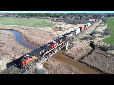 Awesome Aerial View in 4K! Long Stack Train CN 120 w/DPU passing Nappan, NS at Track Speed