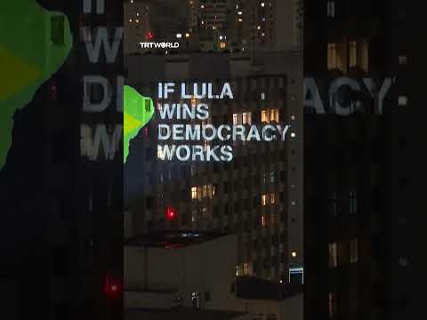 <strong>Anonymous</strong> artist projects protest messages in Sao Paulo ahead of runoff