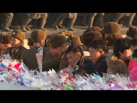 North Koreans lay flowers on 13th anniversary of Kim Jong Il's death | AFP