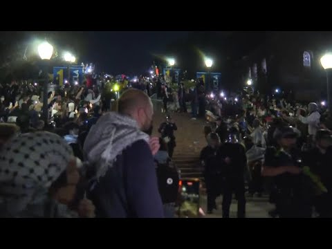 Police march through group of UCLA pro-Palestinian protesters but quickly leave