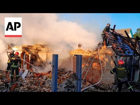 Emergency workers at the scene after Russian strikes in Kyiv region in Ukraine