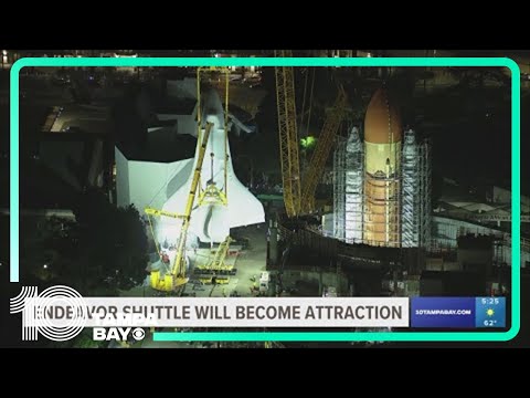 Space Shuttle Endeavour hoisted for installation in vertical display at Los Angeles science museum