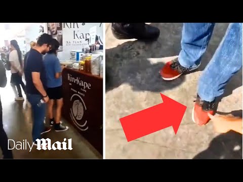 Upskirting professor is fired after woman catches him with hidden camera on his SHOE at public fair