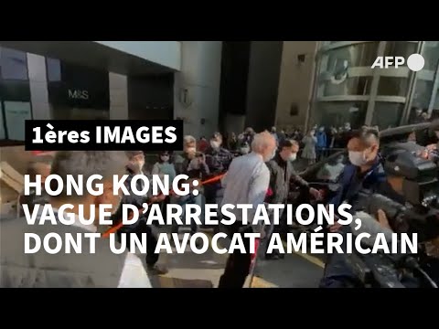 Coup de filet à Hong Kong: l'Américain arrêté est escorté par la police | AFP Images