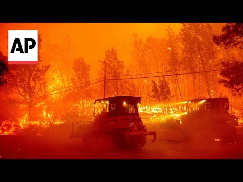 California residents flee massive wildfire sparked by burning car