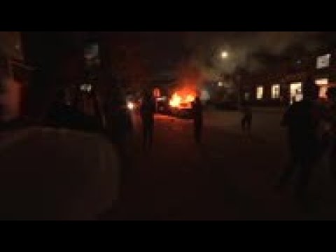 New York protesters set fires, clash with police