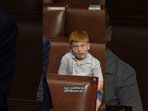 Congressman's son caught makes funny faces during his dad's speech