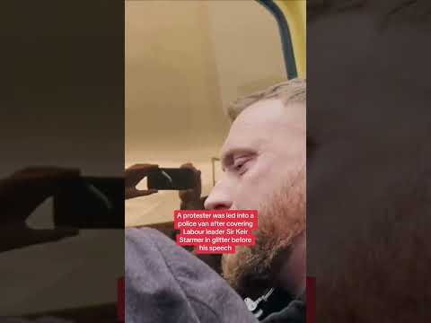Labour protester taken into police van