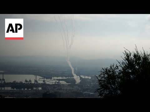 Sirens and smoke in Israel's Haifa following an alert of incoming rockets