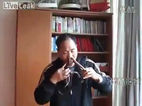 Liu Fei pushing snake in his nose