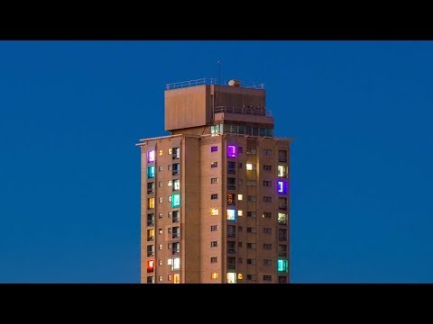 Residents of Sydney high-rise estate use lights to protest against gentrification
