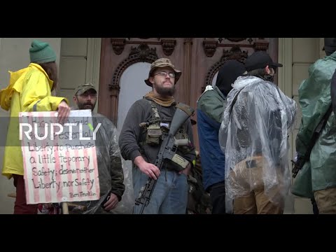 USA: Anti-lockdown protesters brave rain at Lansing demo