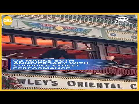 U2 marks <strong>50th</strong> anniversary with surprise street performance