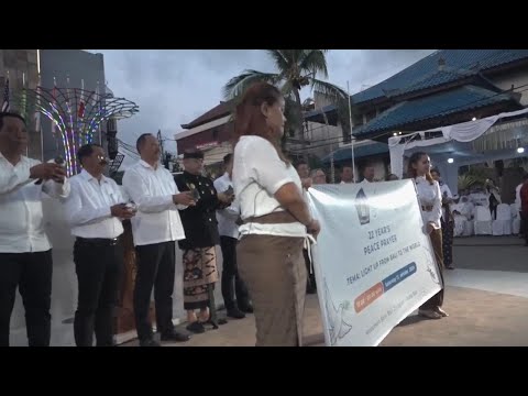 Hundreds gather in Bali to commemorate 22 years since a twin bombing killed 202 people