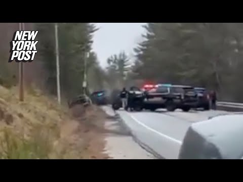 Moment Maine cops unleash hail of bullets at gunman in hospital gown who tried to steal cruiser