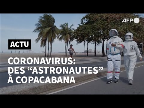 Un couple brésilien en costume d'astronaute contre le coronavirus | AFP