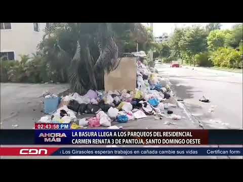 La basura llega a los parqueos del residencial Carmen Renata 3 de Pantoja, Santo Domingo Oeste
