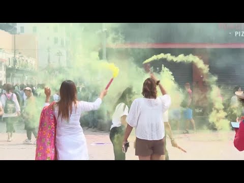 Boisterous celebrations as crowds in Kathmandu mark the Holi festival with coloured powder