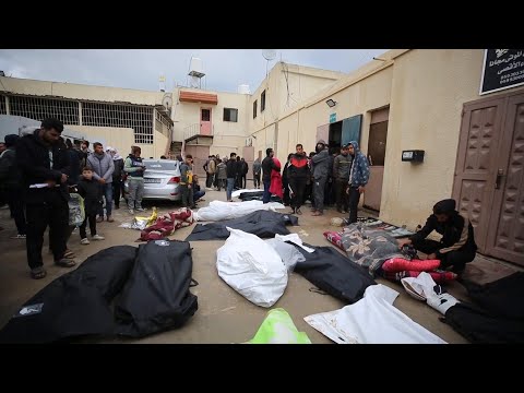 Bodies outside Gaza hospital as death toll from Saturday's airstrikes rises to 58
