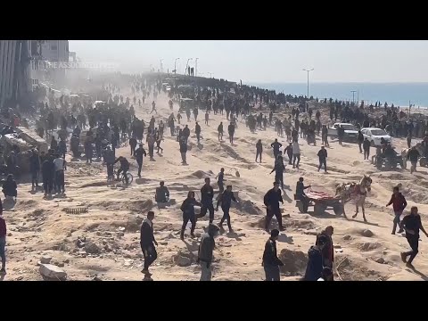 Hundreds wait for aid amongst ruins of Gaza City