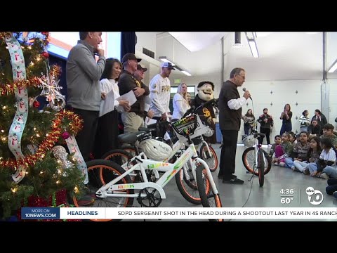 Hundreds of students surprised with bikes and visit from Padres