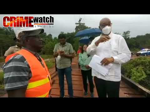GUYANESE MINISTER OF PUBLIC WORKS BISHOP JUAN A. EDGHILL READ THE RIOT ACT TO A CONTRACTOR