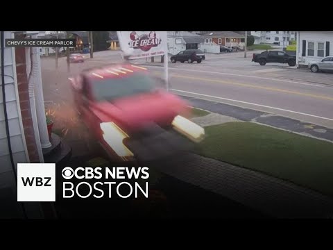Video shows out of control truck hit ice cream shop sign before narrowly missing car with baby insid