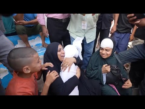 Inconsolable relatives of children killed in strike in central Gaza mourn for their loved ones