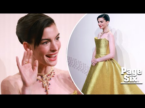 Anne Hathaway glimmers in gold gown and Bulgari jewels in China