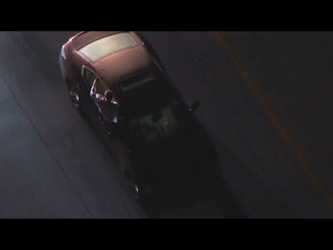 Man Sticks Out the Window During Police Pursuit