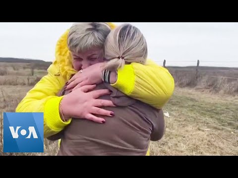 Ukrainian Mothers Hug and Cry as Children Handed Over at Border