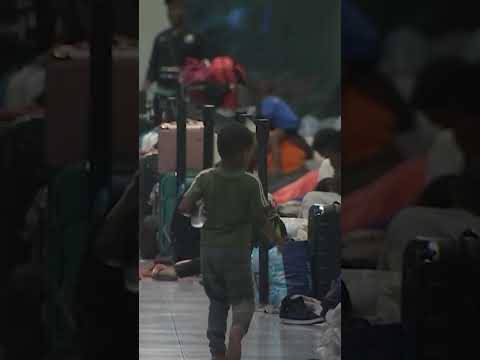 Migrants shelter temporarily in Boston Logan International Airport #Shorts
