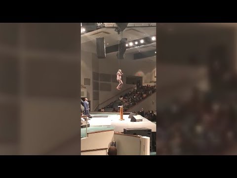 Pastor Makes A Grand Entrance And Flies Into Mass