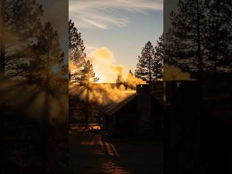 Smoke from cooking drifting above the roof, golden hour sunlight