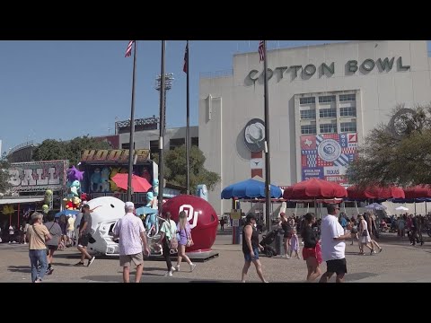 College football fans and workers prepare for the Red River Rivalry