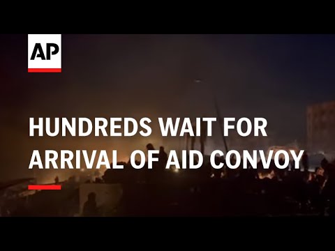 Hundreds wait in Gaza City’s streets for arrival of aid convoy as night falls
