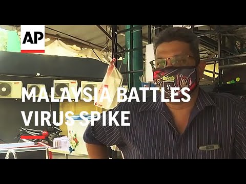 New restrictions as Malaysia battles virus spike