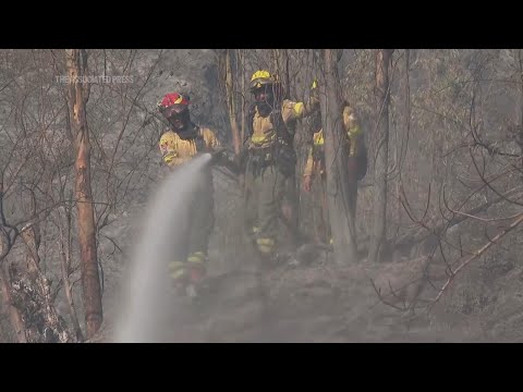 Fires continue to threaten residential areas outskirts of Ecuador's capital city