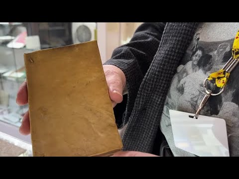 A book bound in human skin is showcased at a New York book fair