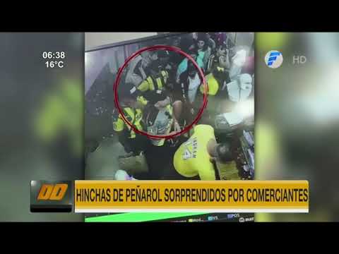 Detuvieron a hinchas de Peñarol por robar un celular en el Mercado 4