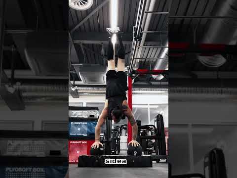 Handstand ball push-up