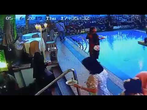 When you are too busy in buffet aftari- the girl fell into the swimming pool