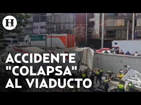 ¡Suman 7 horas de bloqueo por tráiler atorado en Viaducto! Continúan maniobras para retirarlo