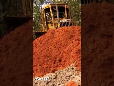 Cat D3 pushing red dirt!