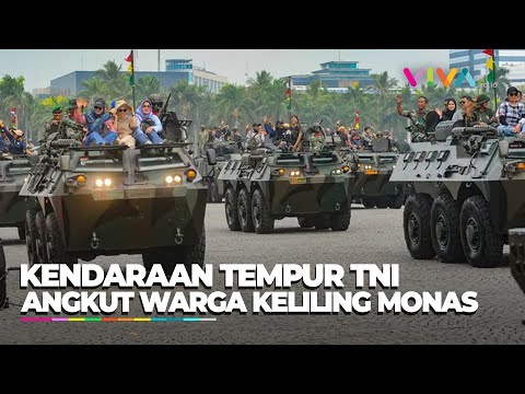 ASYIK! Sejumlah Warga Keliling Monas Naik Ranpur Bareng TNI