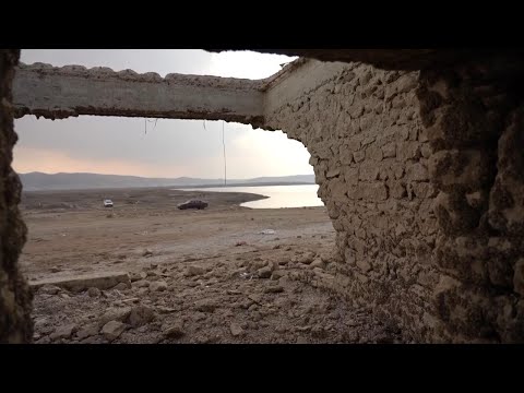 Receding waters of Iraq's Mosul Dam lake uncover long-lost village