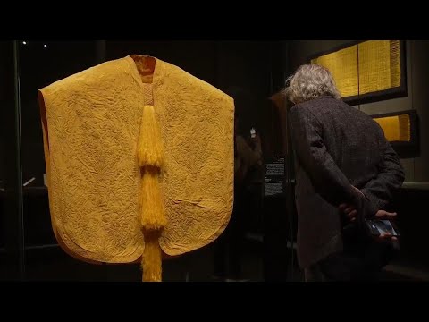 Shiny cape made from threads of over a million golden silk spiders showcased in Qatar