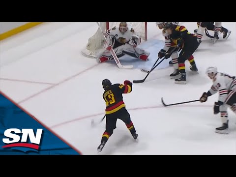 Quinn Hughes Fires A Missile Of A Shot Bar Down On Blackhawks Petr Mrazek