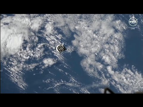 Russian Soyuz spacecraft carrying three astronauts docks at International Space Station